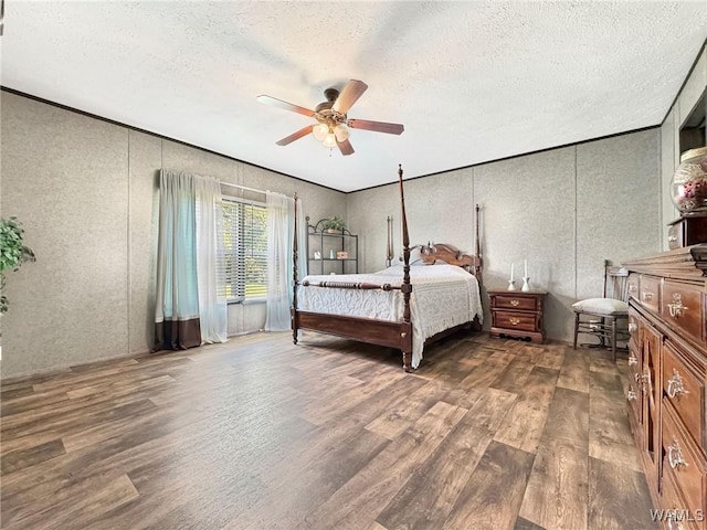 234 Broad Leaf Cir, Moundville, AL 35474 - bedroom featuring wood finished floors, a textured ceiling, ornamental molding, and a ceiling fan