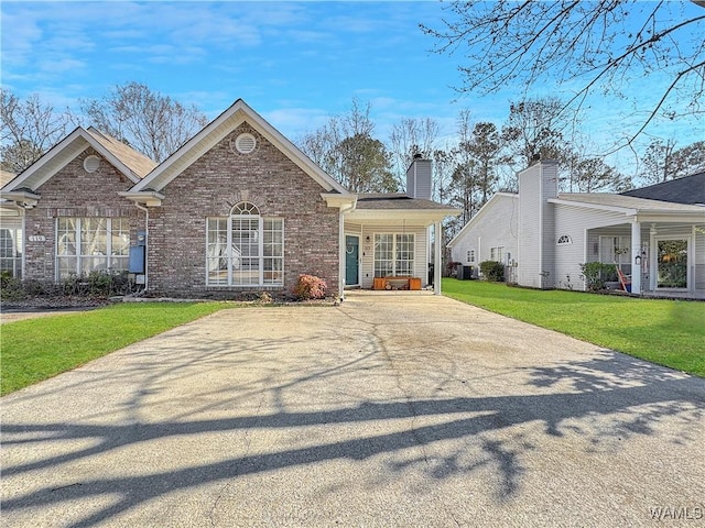 view of front of house with a front yard and a porch