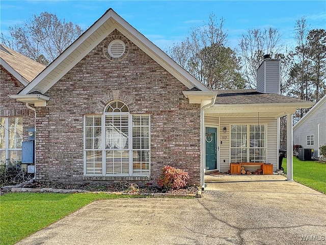 view of property featuring a front lawn and a porch