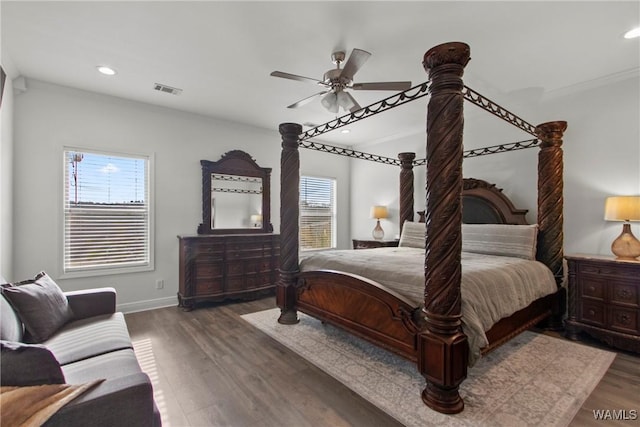 bedroom with ceiling fan and dark hardwood / wood-style floors