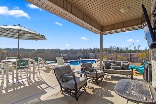 view of patio / terrace featuring a fenced in pool