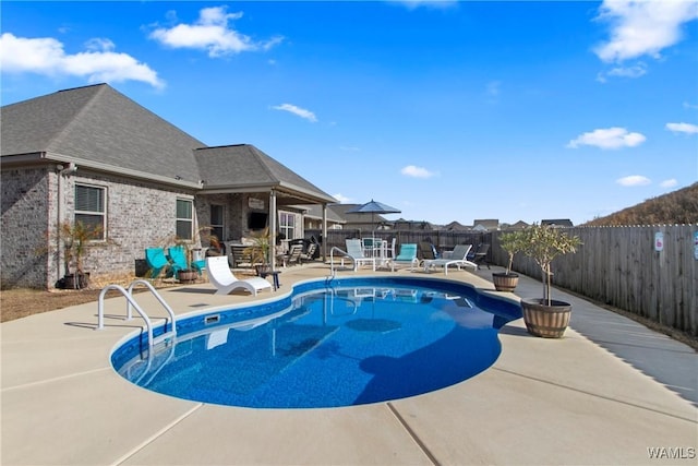 view of pool featuring a patio