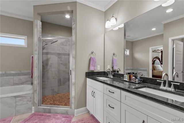 bathroom with vanity, crown molding, and separate shower and tub