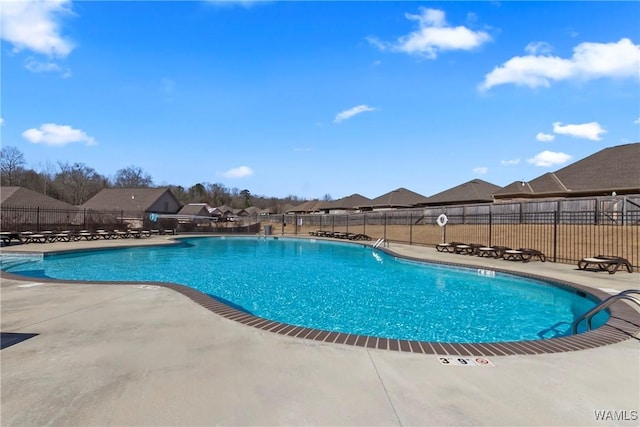 view of swimming pool featuring a patio area