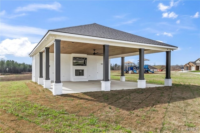 view of patio with ceiling fan and a playground