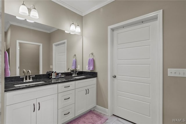 bathroom featuring vanity, crown molding, and tile patterned flooring