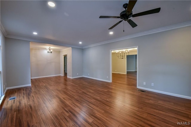 unfurnished room featuring visible vents, wood finished floors, and ceiling fan with notable chandelier