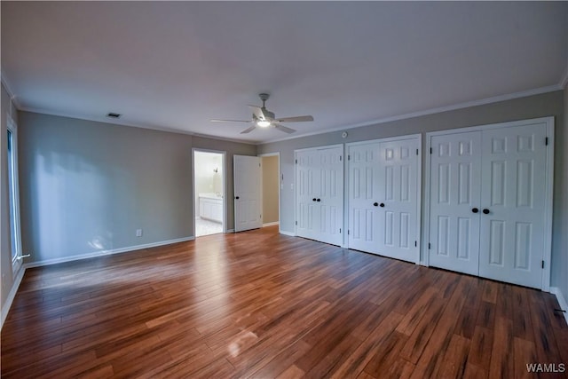 unfurnished bedroom featuring ornamental molding, baseboards, and wood finished floors