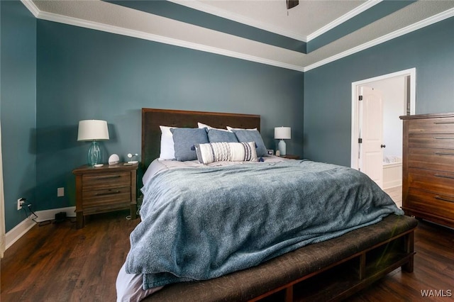 bedroom with wood finished floors, baseboards, and ornamental molding