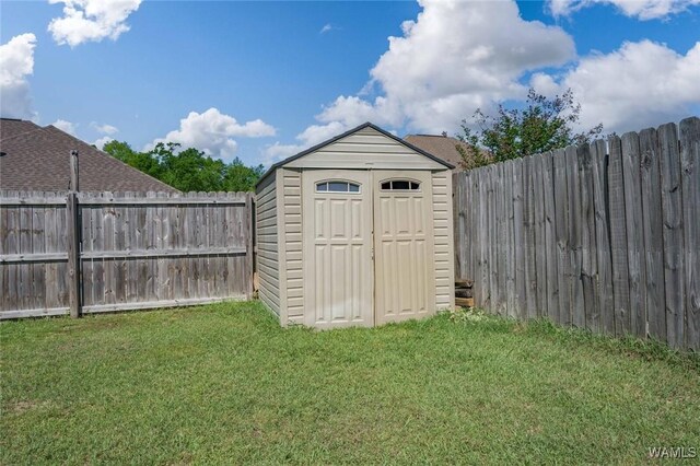 view of shed featuring a fenced backyard