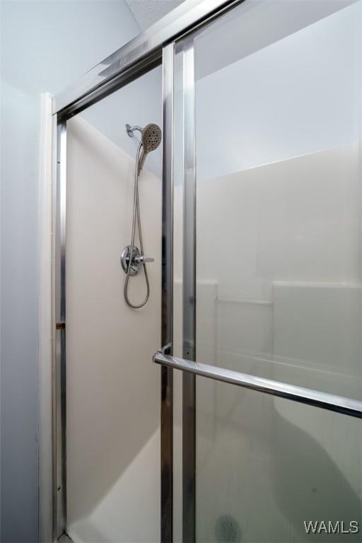 full bathroom featuring a stall shower