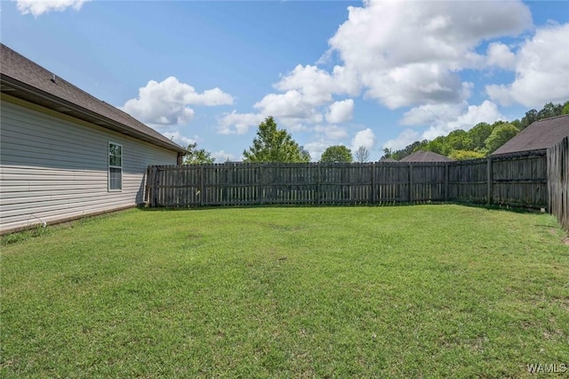view of yard with a fenced backyard