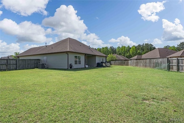 view of yard featuring cooling unit and a fenced backyard