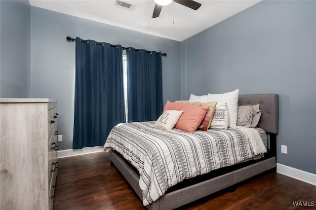 bedroom featuring visible vents, wood finished floors, baseboards, and a ceiling fan