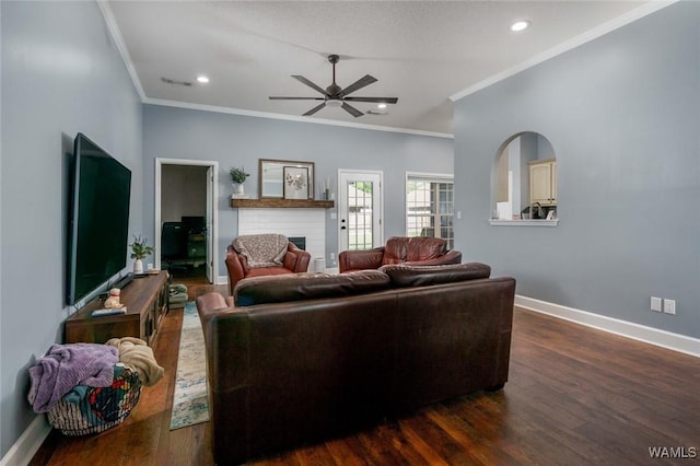 living area featuring a ceiling fan, baseboards, crown molding, and visible vents