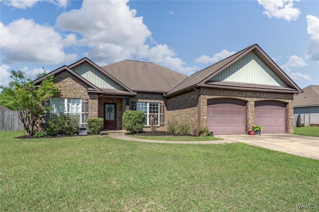 view of front of property featuring brick siding, driveway, a front yard, and a garage