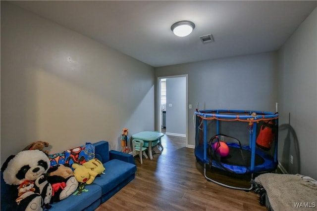 13024 Brookview Way, Northport, AL 35473 - recreation room featuring visible vents, baseboards, and wood finished floors