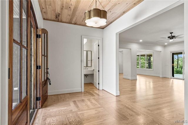 13952 Watercolor Pointe, Northport, AL 35475 - unfurnished living room featuring crown molding, ceiling fan, baseboards, and wood finished floors