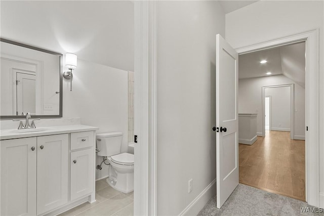 13952 Watercolor Pointe, Northport, AL 35475 - hallway with visible vents, lofted ceiling, wood finished floors, recessed lighting, and an upstairs landing