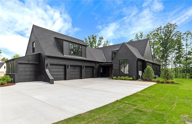 13952 Watercolor Pointe, Northport, AL 35475 - view of front facade with a garage, roof with shingles, a front yard, and concrete driveway