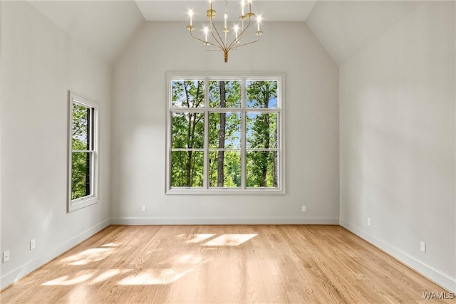 13952 Watercolor Pointe, Northport, AL 35475 - unfurnished dining area featuring baseboards, an inviting chandelier, plenty of natural light, and wood finished floors