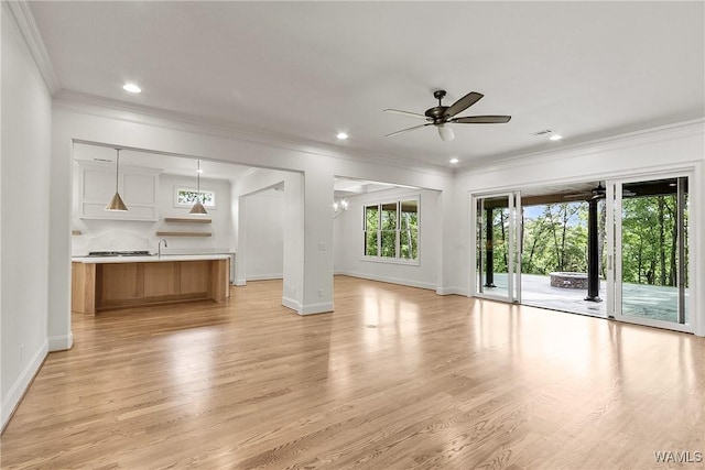 13952 Watercolor Pointe, Northport, AL 35475 - unfurnished living room featuring crown molding, recessed lighting, a ceiling fan, and light wood finished floors