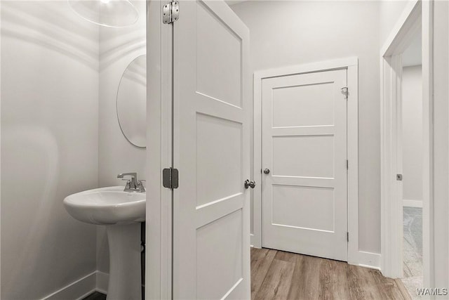11480 Saint Joseph St, Northport, AL 35475 - bathroom featuring wood finished floors and baseboards