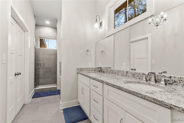 11480 Saint Joseph St, Northport, AL 35475 - full bath with a shower stall, double vanity, baseboards, recessed lighting, and tile patterned flooring