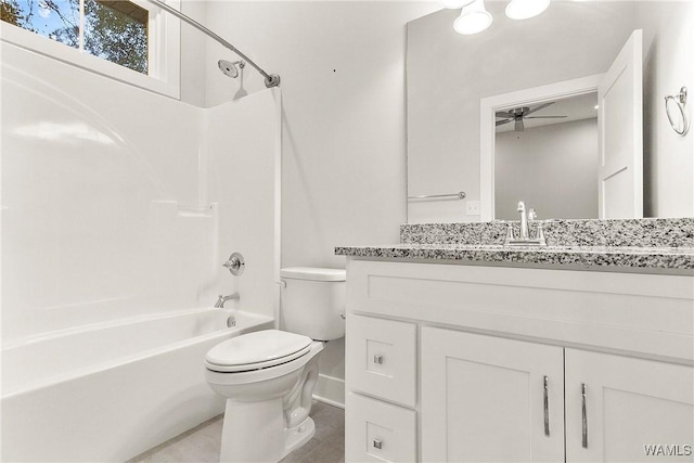 11480 Saint Joseph St, Northport, AL 35475 - bathroom featuring toilet, a ceiling fan, tub / shower combination, vanity, and baseboards