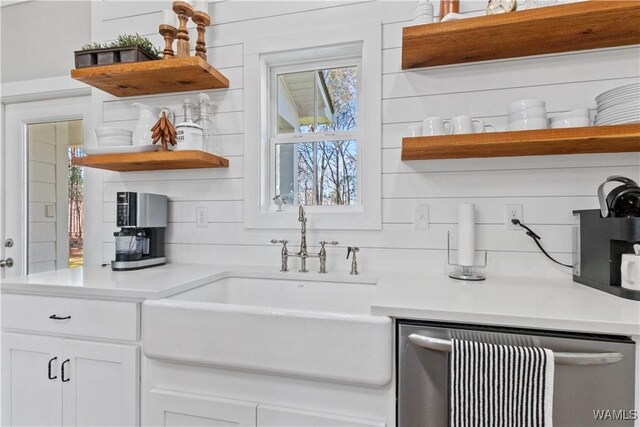 kitchen featuring white cabinets, dishwasher, decorative backsplash, and open shelves