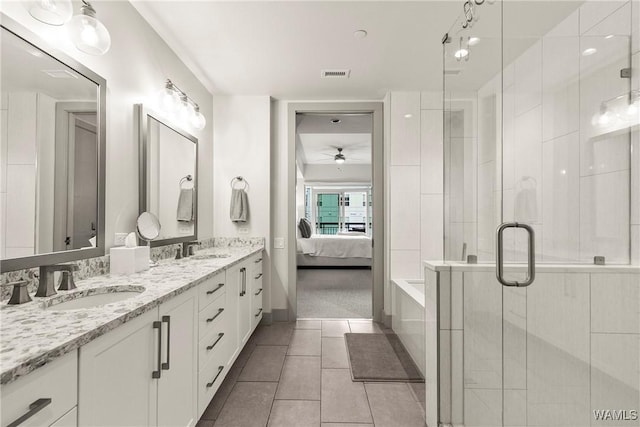 ensuite bathroom featuring ensuite bathroom, tile patterned flooring, a sink, and visible vents