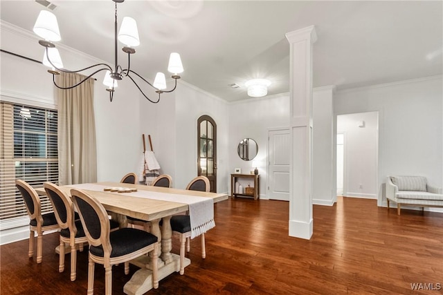13862 Willow View Ln, Northport, AL 35475 - dining room featuring crown molding, wood finished floors, arched walkways, and a chandelier
