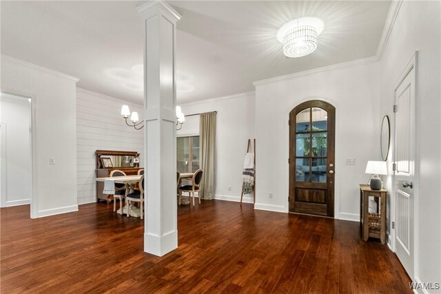 13862 Willow View Ln, Northport, AL 35475 - entrance foyer with a chandelier, wood finished floors, ornamental molding, and arched walkways