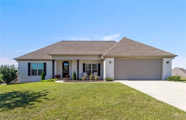 13862 Willow View Ln, Northport, AL 35475 - view of front of home with a garage, driveway, a front yard, and stucco siding