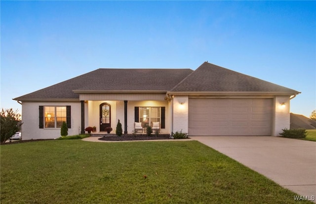 13862 Willow View Ln, Northport, AL 35475 - ranch-style home featuring a garage, driveway, a front lawn, a porch, and stucco siding