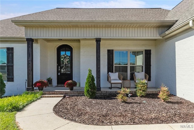 13862 Willow View Ln, Northport, AL 35475 - property entrance featuring a porch, brick siding, and roof with shingles