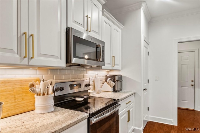 13862 Willow View Ln, Northport, AL 35475 - kitchen featuring appliances with stainless steel finishes, crown molding, backsplash, white cabinets, and dark wood-type flooring