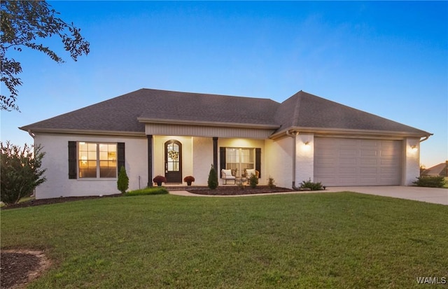 13862 Willow View Ln, Northport, AL 35475 - view of front of house with driveway, a garage, a lawn, and roof with shingles