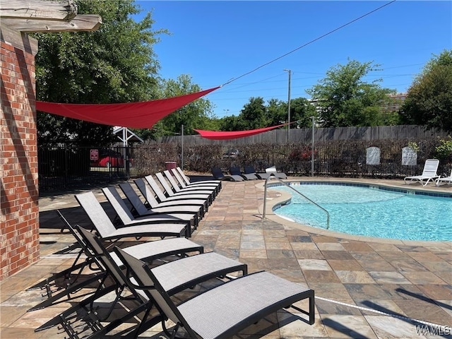 view of pool featuring a patio