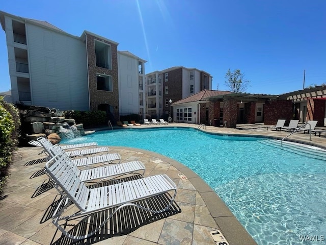 view of pool featuring a patio and pool water feature