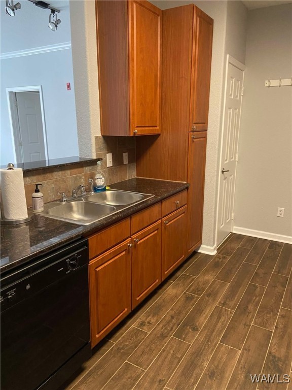 kitchen featuring sink, crown molding, decorative backsplash, and dishwasher