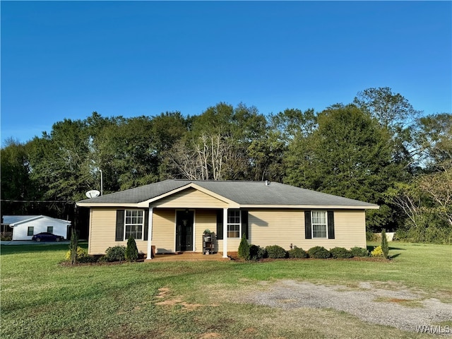 ranch-style home with a front lawn