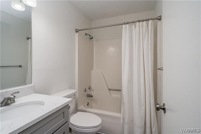 full bathroom featuring a textured ceiling, vanity, shower / tub combo, and toilet