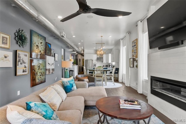 1038 14th Ave Unit B, Tuscaloosa, AL 35401 - living room with a glass covered fireplace, a ceiling fan, recessed lighting, and wood finished floors