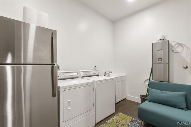 1038 14th Ave Unit B, Tuscaloosa, AL 35401 - laundry room with baseboards and dark wood finished floors