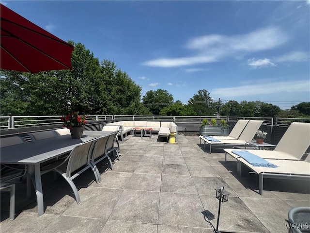 1038 14th Ave Unit B, Tuscaloosa, AL 35401 - view of patio with an outdoor living space, outdoor dining space, and view of wooded area