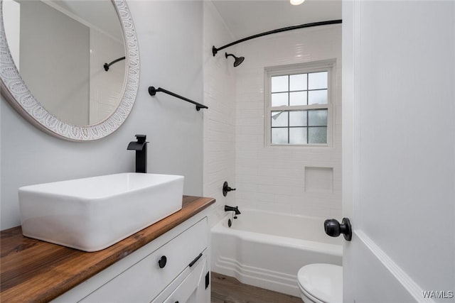 11376 Kings Loop Rd, Tuscaloosa, AL 35405 - bathroom with vanity, washtub / shower combination, and wood finished floors