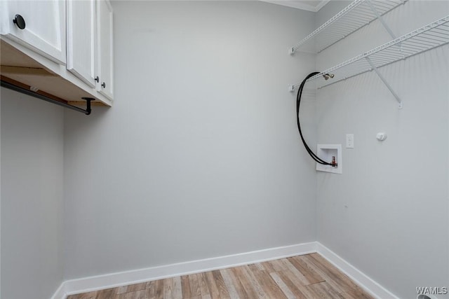 11376 Kings Loop Rd, Tuscaloosa, AL 35405 - laundry area with cabinet space, washer hookup, light wood finished floors, and crown molding