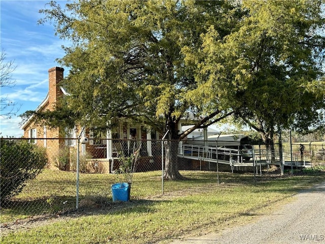 view of front of property with a chimney and fence