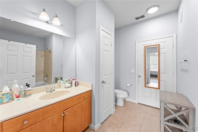 full bath featuring tile patterned flooring, visible vents, toilet, vanity, and walk in shower